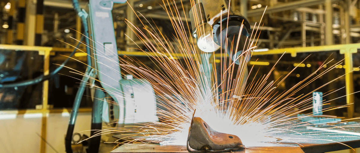 CNC Welding Machine in a factory setting with sparks flying