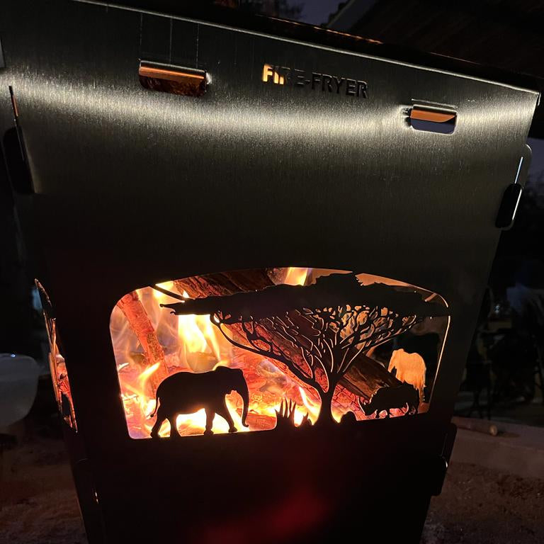 Stainless steel braai being used with firewood 